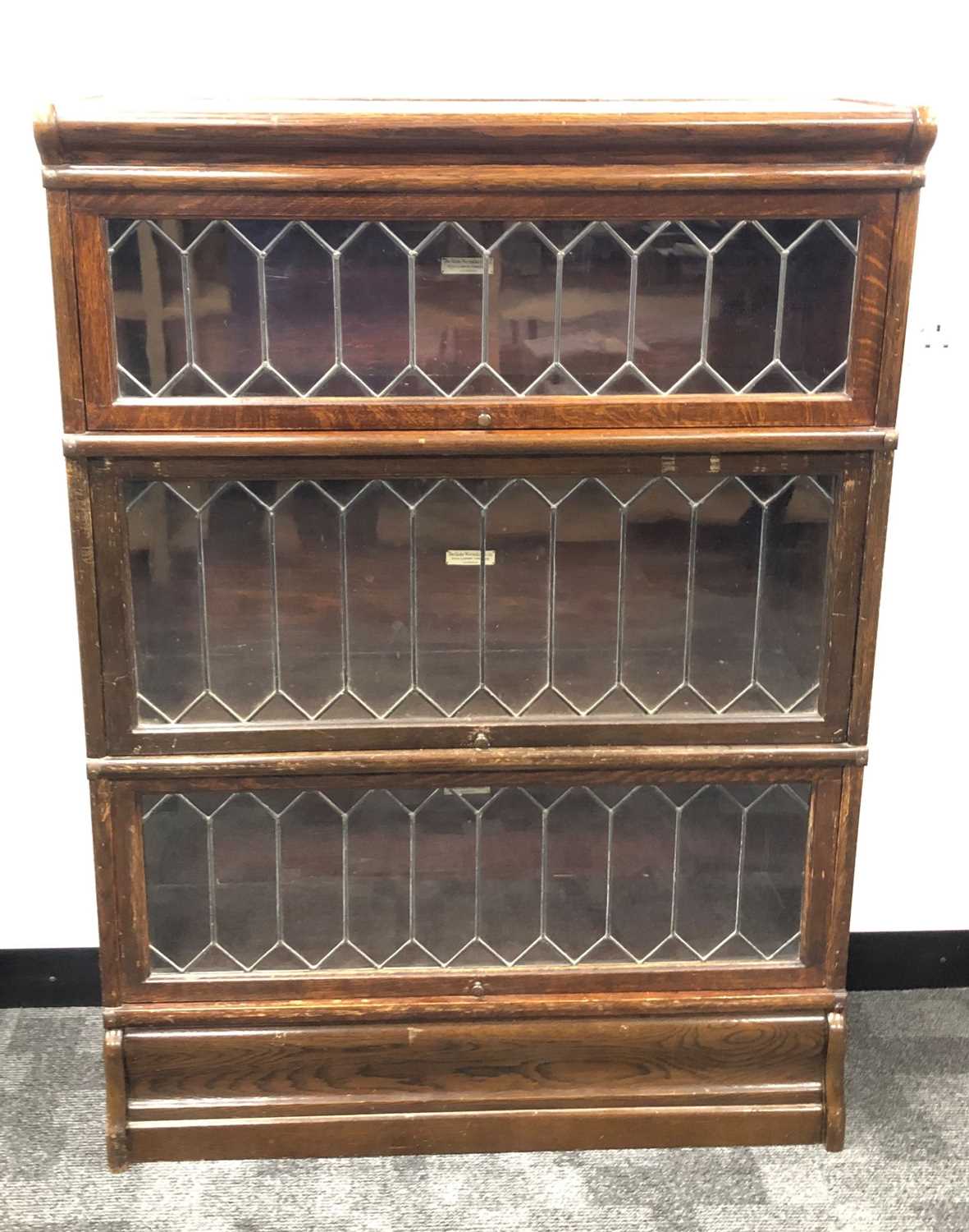 Lot 347 - A Globe Wernicke & Co. stained oak stackable bookcase