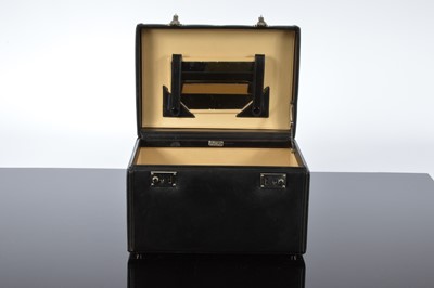 Lot 120 - An Etienne Aigner black leather vanity case