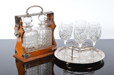 Lot 127 - An Edwardian silver plated and oak tantalus