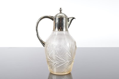 Lot 133 - An Edwardian glass and silver mounted Claret jug