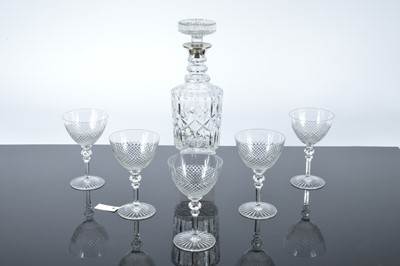 Lot 155 - A c1960s cut glass decanter with silver mount and a set of five cut glass wine glasses (6)