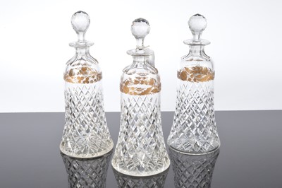 Lot 156 - A nice set of three cut glass decanters