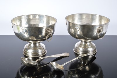 Lot 158 - A pair of silver plated bunch bowls, 27cm diameter, with applied George III copper half pennies and now silver plated, together with two silver plated ladles (4)