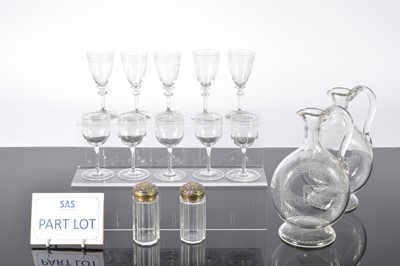 Lot 162 - A set of four Edwardian glass moon flask decanters and a suite of small liquor glasses