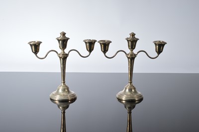 Lot 170 - A pair of 1960s silver filled short table candelabra from Adie Bros