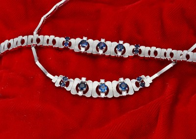 Lot 203 - A continental 750 marked white gold bracelet and necklace set with sapphires and diamonds