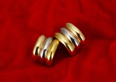 Lot 210 - A pair continental three colour yellow and white metal ear cuffs