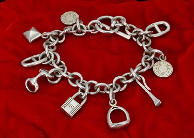 Lot 214 - A Hermes silver charm bracelet