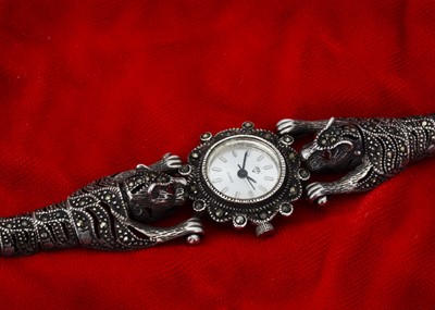 Lot 215 - A continental silver and marcasite and red paste 'Panther' wristwatch