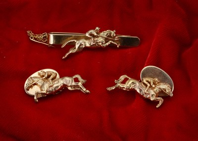 Lot 222 - A pair of 9ct gold hose racing cufflinks and matching tie slide