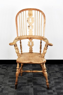 Lot 374 - A 19th century bleached mixed wood Windsor armchair