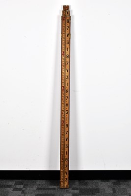 Lot 392 - An extendable measuring stick