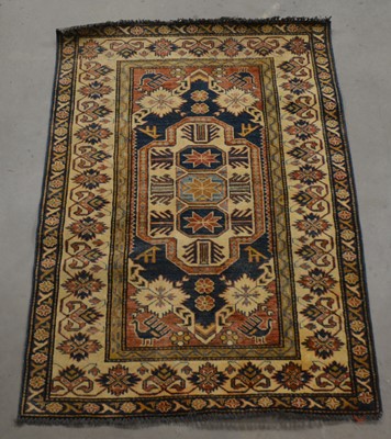 Lot 411 - A small Persian woollen rug