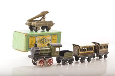 Lot 921 - A small Bing 0 Gauge clockwork Passenger Train and 'Astra' railed Gun