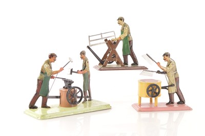 Lot 1215 - A fine group of Bing moustachioed 'Workman' Toys (3)