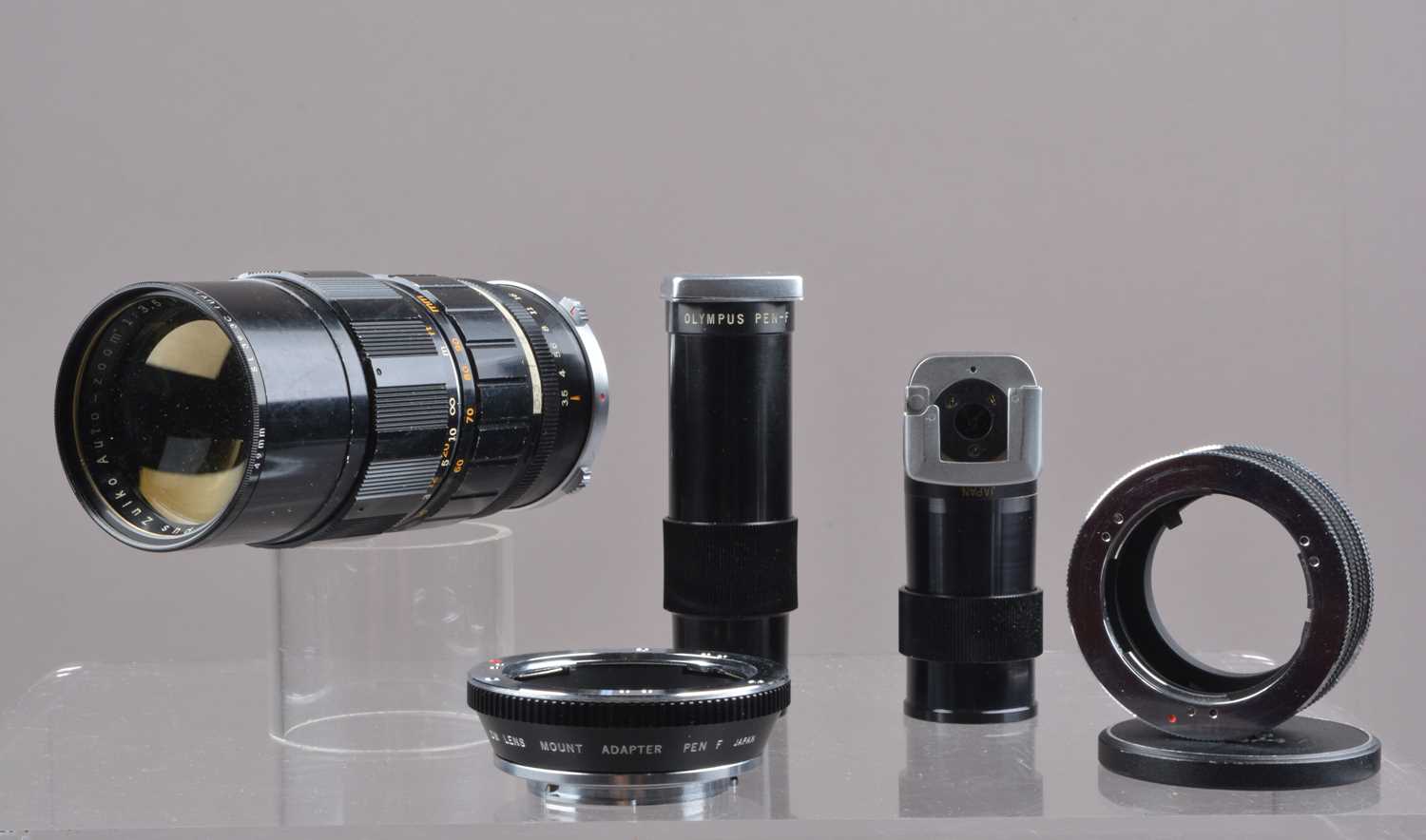 Lot 113 - An Olympus Pen Zuiko 50-90mm f/3.5 Lens and Olympus Pen Accessories