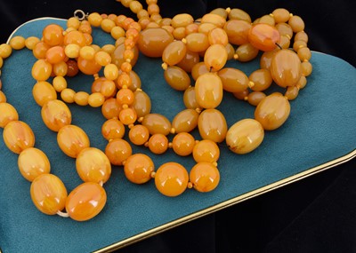 Lot 34 - Five 'Simulated' Amber Resin necklaces