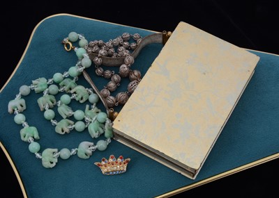 Lot 55 - A string of jadeite jade and boneite beads