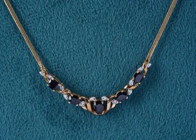 Lot 64 - A 9ct gold sapphire and diamond necklace and pendant