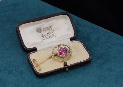 Lot 70 - An Edwardian seed pearl and synthetic ruby oval brooch