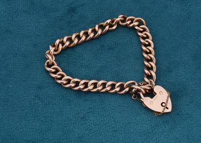 Lot 83 - A 9ct gold curb link padlock clasp bracelet