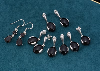 Lot 86 - Five pairs of smoky quartz set silver earrings