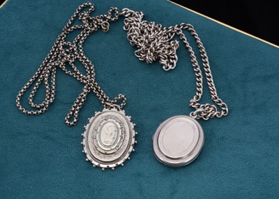 Lot 103 - Two silver lockets and chains