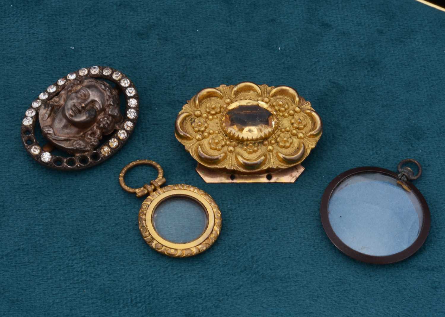 Lot 107 - A white metal openwork circular locket,