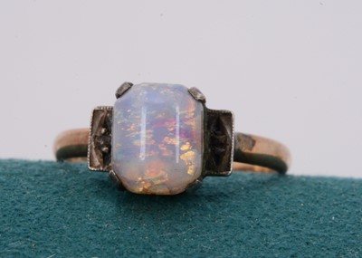 Lot 141 - A 9ct gold and silver set simulated opal dress ring