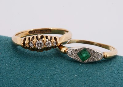 Lot 154 - An 18ct gold emerald and diamond ring