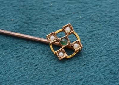 Lot 158 - An Edwardian demantoid garnet and seed pearl stick pin