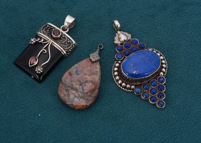 Lot 168 - A silver and lapis lazuli cluster pendant