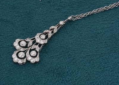 Lot 172 - An Art Deco diamond platinum drop pendant and chain