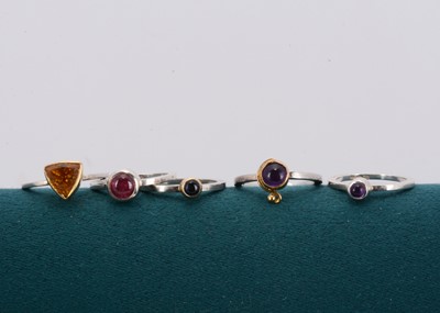 Lot 178 - A set of silver gem set stacking rings