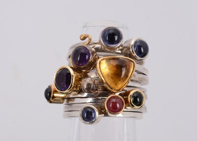 Lot 179 - A set of five gem set silver and gold dress rings