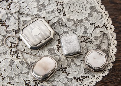 Lot 235 - Four miniature silver compacts on chains