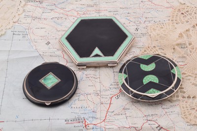 Lot 255 - Three art deco black and green enamelled compacts