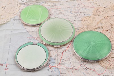 Lot 261 - Four circular Art Deco green guilloche enamelled silver compacts