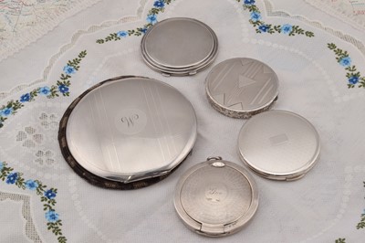 Lot 268 - Five circular silver engine turned compacts