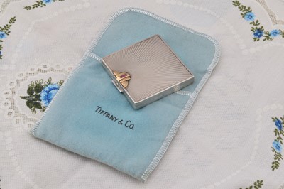 Lot 281 - A square Tiffany c1930 sterling silver and 14ct gold mounted compact