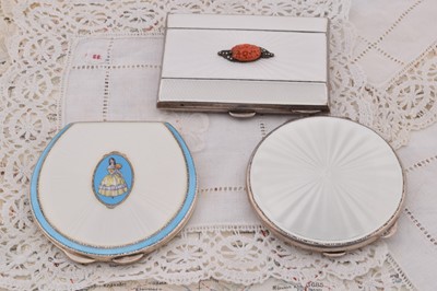 Lot 294 - Three silver white guilloche enamel decorated compacts