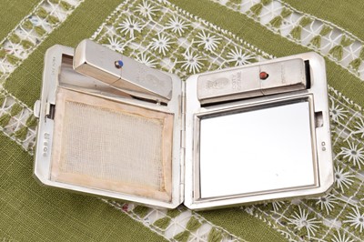 Lot 299 - A square engine turned decorated compact duo