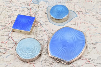 Lot 301 - Four silver blue guilloche enamel mounted compacts