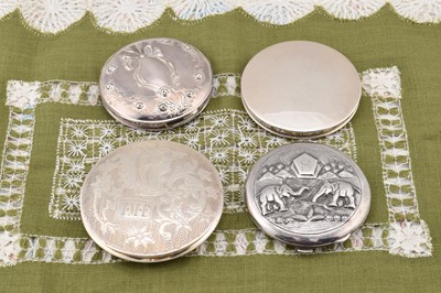 Lot 302 - Four silver circular compacts