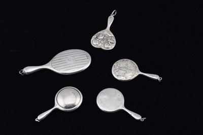 Lot 312 - Five silver miniature hand mirrors