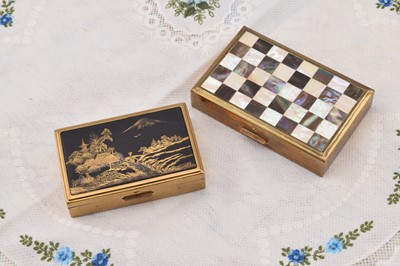 Lot 322 - Two Clover rectangular gilt metal musical compacts