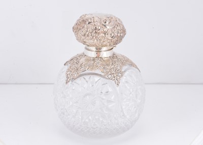 Lot 411 - A large Edwardian cut glass and silver mounted scent bottle by William Hutton & Son