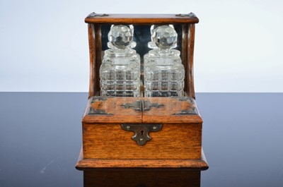 Lot 463 - An Art Deco period oak tantalus