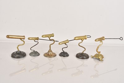 Lot 62 - A group of six small brass barrelled Goffering Irons