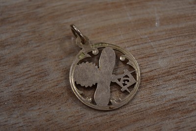 Lot 106 - A 9ct Gold and Enamel Masonic Pendant